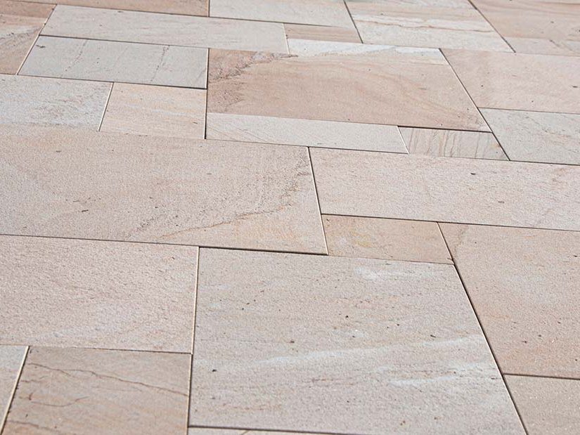 Natural travertine stone tile installed on a Miami outdoor deck